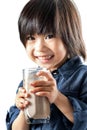 Cute asian youngster drinking chocolate milk.