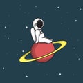 Cute astronaut sits on Saturn