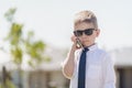 Cute Australian boy using mobile phone Royalty Free Stock Photo