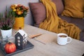 Cozy Place to Relax on Balcony or Terrace with Cute Autumn Hygge Home Decor and Blooming Flowers.