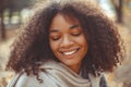 Cute autumn portrait of young happy curly african american woman enjoying fall season in park Royalty Free Stock Photo