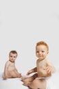 Cute Babies Sitting On White Background