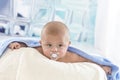 Cute baby with adorable face nipple in bath towel after Royalty Free Stock Photo