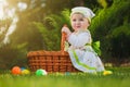 Cute baby with basket in the green park Royalty Free Stock Photo