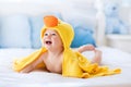 Cute baby after bath in yellow duck towel Royalty Free Stock Photo