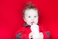 Cute baby with big blue eyes drinking milk Royalty Free Stock Photo