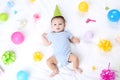 Cute baby with birthday decorations