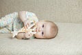 Cute baby biting toy giraffe Royalty Free Stock Photo