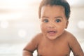 Cute baby, black kid and happy portrait with bokeh, mockup and space in nursery room, happiness and relax. Young infant