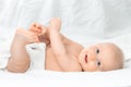 Cute baby with blue eyes lying on bed Royalty Free Stock Photo