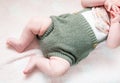 Cute baby body lying on his back on a pink blanket Royalty Free Stock Photo