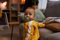 Cute baby boy with binky taking first steps Royalty Free Stock Photo