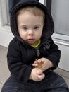 Cute baby boy in black hoodie