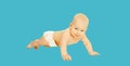 Cute baby boy crawling on the floor on blue background Royalty Free Stock Photo