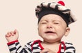 Cute baby boy crying raising his hands up. Royalty Free Stock Photo