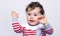 Cute baby boy crying raising his hands up. Royalty Free Stock Photo