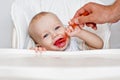 Cute baby boy eating at a table Royalty Free Stock Photo