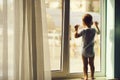 Baby boy on window sill Royalty Free Stock Photo