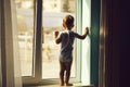 Baby boy on window sill Royalty Free Stock Photo