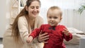 Cute baby boy learning walking and smiling while making first steps. Baby development, child playing games, education and learning Royalty Free Stock Photo