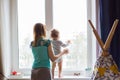 Cute baby boy looks in the window Royalty Free Stock Photo