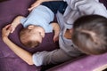 Amazing brunette female person calming her little kid Royalty Free Stock Photo