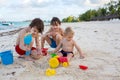 Cute baby boy playing with beach toys on tropical beach Royalty Free Stock Photo