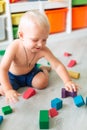 Cute baby boy playing with building blocks Royalty Free Stock Photo