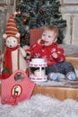 Cute baby boy playing with Christmas tree decoration Royalty Free Stock Photo