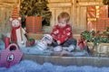 Cute baby boy playing with Christmas tree decoration Royalty Free Stock Photo