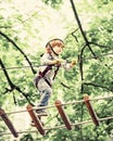 Cute baby boy playing. Kid climbing trees in park. Hike and kids concept. Beautiful little child climbing and having fun Royalty Free Stock Photo