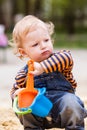 Cute baby boy playing with sand Royalty Free Stock Photo