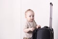 Cute baby boy ready for a crusie. Smiling infant kid going to a trip. Copy space