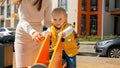 Cute baby boy riding on the bouncy spring rider on the the playground at amusement park. Children playing outdoor, kids outside, Royalty Free Stock Photo