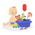 Cute baby boy sitting with pile of colorful toys Royalty Free Stock Photo