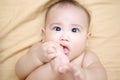 Cute Baby Boy sucking thumb on the bed Royalty Free Stock Photo