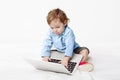 Cute baby boy typing on laptop keyboard Royalty Free Stock Photo
