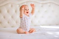 Cute baby boy in white sunny bedroom Royalty Free Stock Photo