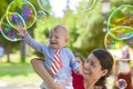 Cute Baby Catching Soap Bubbles Royalty Free Stock Photo