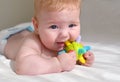 Cute baby chewing colorful silicone teething toy Royalty Free Stock Photo