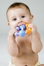 Cute Baby Chewing on Toy