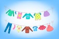 Cute baby clothes drying on the rope