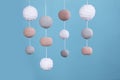 Cute baby crib mobile on light blue background Royalty Free Stock Photo