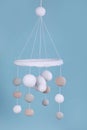 Cute baby crib mobile on light blue background Royalty Free Stock Photo