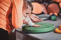 Cute baby is curious about special treatment toy