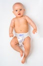 Cute baby in diaper lying on back - isolated on white Royalty Free Stock Photo