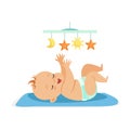 Cute baby in a diaper lying in bed and having fun with toy carousel, colorful cartoon character vector Royalty Free Stock Photo