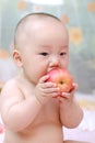 Cute baby eat apple Royalty Free Stock Photo