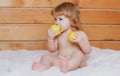 Cute baby eat apple. Funny baby eat apples. Kid eating fruit. Healthy nutrition for kids. Solid food for infant. Royalty Free Stock Photo