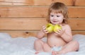 Cute baby eat apple. Happy little baby boy eating apple. Kid with fresh fruit. Royalty Free Stock Photo